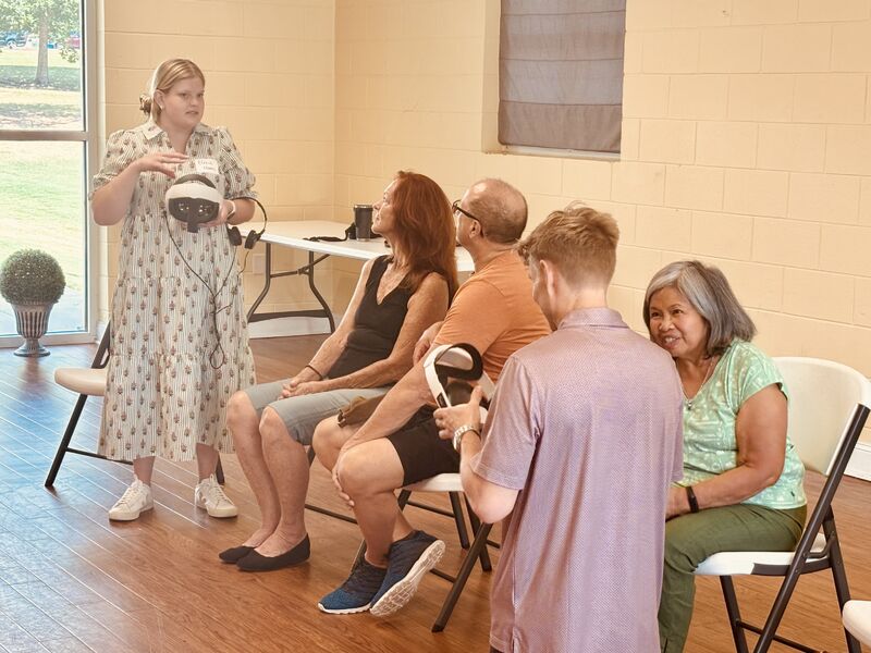 Eliza demonstrating virtual reality during community outreach